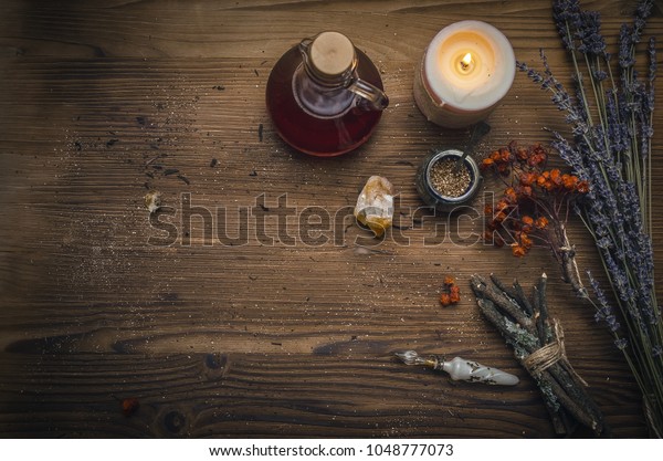 Magic potion. Alternative herbal medicine. Shaman\
table with copy space. Druidism concept. Witch doctor desk\
background with copy\
space.