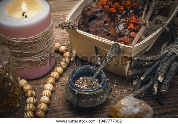 Magic
potion. Alternative herbal medicine. Shaman table with copy space.
Druidism concept. Witch doctor desk
background.
