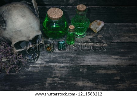 Magic potion on magic table background. Witchcraft concept.