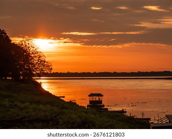 Magic sunset with beautiful clouds over the Amazon river. Amazonia. Latin America.