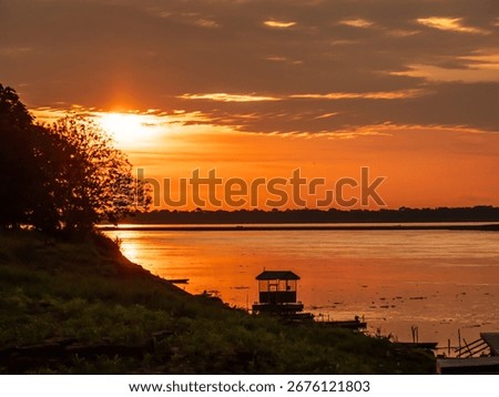 Magic sunset with beautiful clouds over the Amazon river. Amazonia. Latin America.