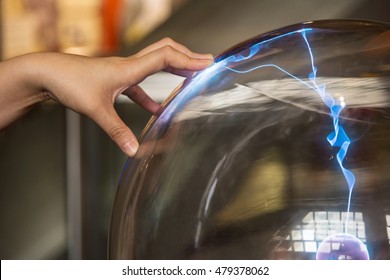 Magic Transparent Or Plasma Ball With Electricity Followed By Hand