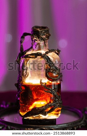 Magic vial with a glowing potion inside