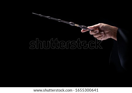 Magic wand in black background, Miracle magical stick Wizard tool.