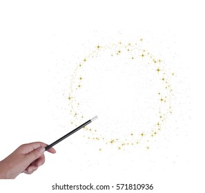Magic wand in hand isolated on white. Gold stars. With copy space. Make wishes come true.