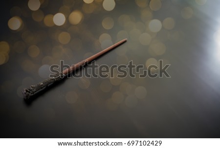 Magic wand on wooden table, Wizard tool.