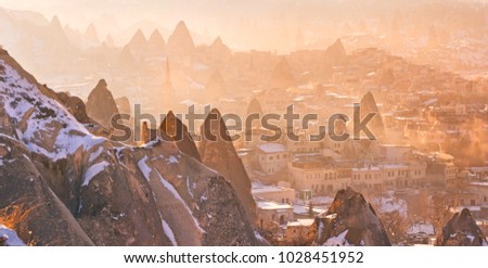 The magic winter landscape of Cappadocia, in the warm sunset light.