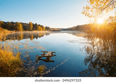 A magical autumn day on a quiet lake surrounded by a forest. Location place Small Polissya, Ukraine, Europe. Fresh and bright colors on the lake. Perfect photo wallpaper. Discover the beauty of earth. - Powered by Shutterstock