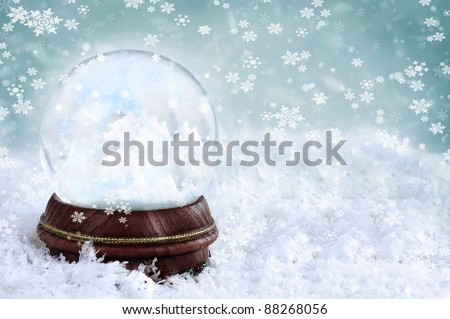 Magical Christmas snow globe with clouds and copy space inside. Shallow depth of field with selective focus on snowglobe.