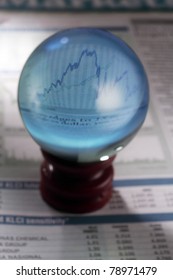 Magical Crystal Ball On The Finance Section Of Newspaper