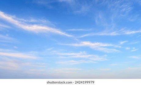 Magical dreamy blue sky. Panorama of the blue-pink sunset sky - the gentle sky on the horizon. Natural sky, amazing and cinematic texture background. With Cirrus clouds. - Powered by Shutterstock