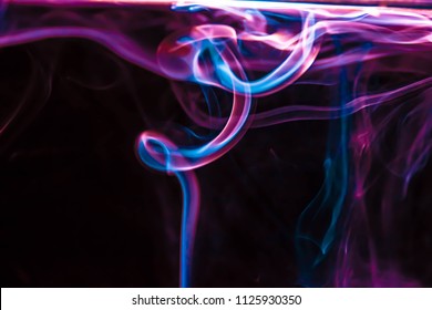 Magical, mystery Abstract colored background. beautiful colorful smoke, ink in water, the patterns of the universe. Abstract movement, frozen multi color flow of paint. 
 - Powered by Shutterstock