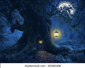 Magical night with a little home in the trunk of an ancient tree in the enchanted forest.