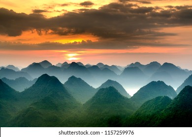 The magical scene of the mountains resemble the successive message they are covered with layers of lush green vegetation at dawn in Bac Son district Lang Son Province, Vietnam

 - Shutterstock ID 1157259976