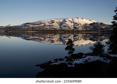 Magical View Of The Andes Mountains, Forest And Blue Sky Reflection In The Lake At Sunrise.