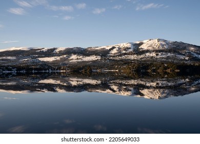 Magical View Of The Andes Mountains, Forest And Blue Sky Reflection In The Lake At Sunrise.	
