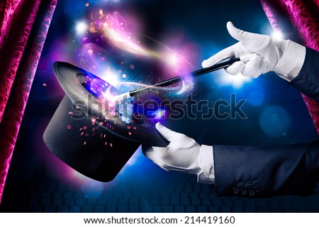 Magician hand with magic wand and hat