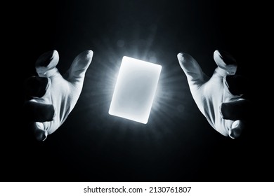 Magician hands showing magic trick isolated on black background
