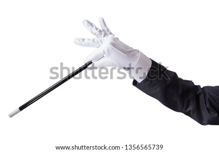 Magician holding his wand, isolated on white