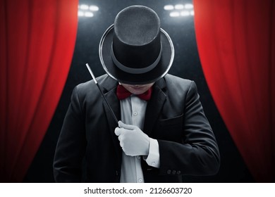 Magician Holding Magic Wand On Stage