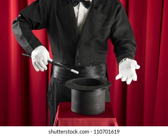 Magician Holding Magic Wand And Top Hat