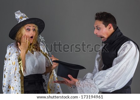 Magician man and fairy girl surprises of hat
