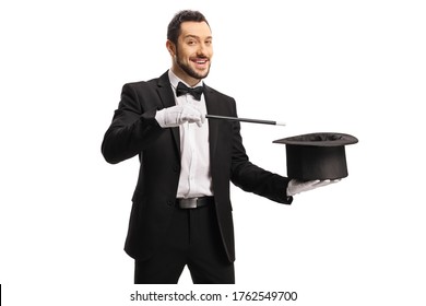 Magician performing a hat-trick with a magic wand isolated on white background