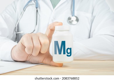 Magnesium Mg supplements for human health. Doctor recommends taking magnesium Mg. doctor talks about Benefits of magnesium. Essential vitamins and minerals for humans. Mg Health Concept. - Shutterstock ID 2083768852