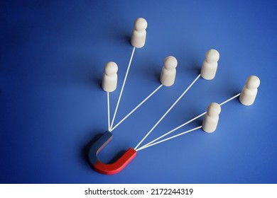 Magnet attracts employee candidates dolls. Hiring staff. Find best talent, Human resources concept - Shutterstock ID 2172244319