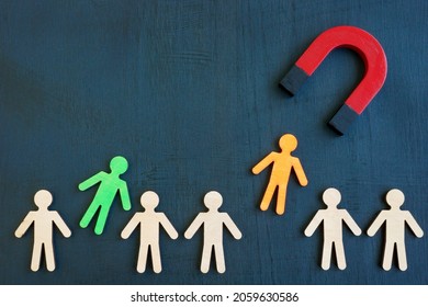The magnet attracts figures from the crowd. Talent acquisition concept. - Shutterstock ID 2059630586