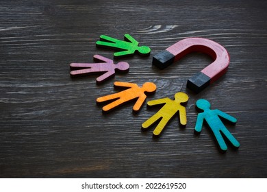 Magnet and figures of people. Customer acquisition and retention. - Shutterstock ID 2022619520