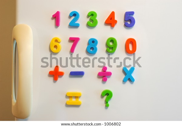 Magnet numbers on fridge\
door