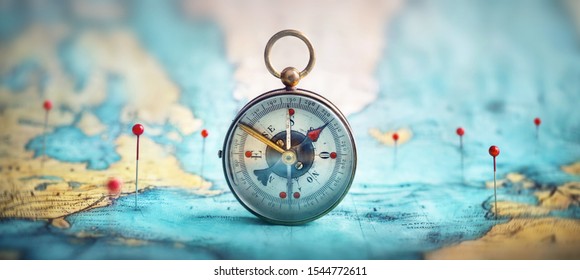 Magnetic Compass  And Location Marking With A Pin On Routes On World Map. Adventure, Discovery, Navigation, Communication, Logistics, Geography, Transport And Travel Theme Concept Background.
