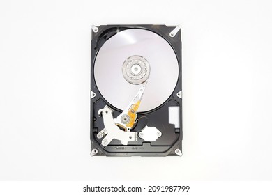 Magnetic disks inside HDD. Modern digital technology. Open computer hard drive on white background  HDD, Winchester PC.