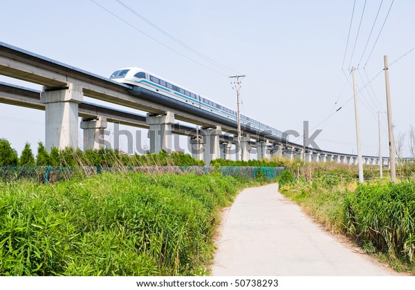 magnetic levitation (maglev)\
train travels at 431 km per hour through suburban shanghai,\
china