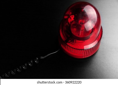 Magnetic Mounted Red Vehicle Police Strobe Rotating Flash Warning Light Beacon Flashing Emergency Lights On Black Background, Top View