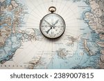 Magnetic old compass on old nord pole map. Travel, geography, history, navigation, tourism and exploration concept background. Retro compass on geography map.