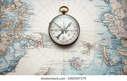 Magnetic old compass on old nord pole map. Travel, geography, history, navigation, tourism and exploration concept background. Retro compass on geography map.