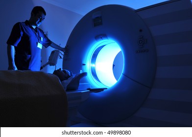 Magnetic Resonance Imaging machine operator and a patient -a series of MRI.