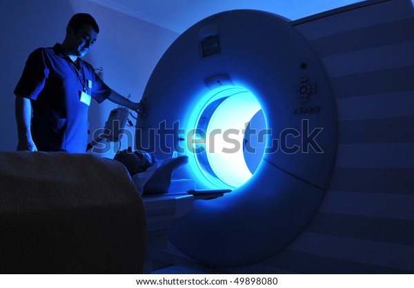 Magnetic Resonance Imaging machine operator and a\
patient -a series of\
MRI.