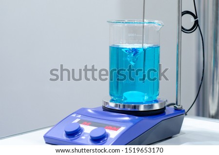 A magnetic stirrer or magnetic mixer is a laboratory device that employs a rotating magnetic field to cause a stir bar immersed in a liquid to spin very quickly, thus stirring it. 