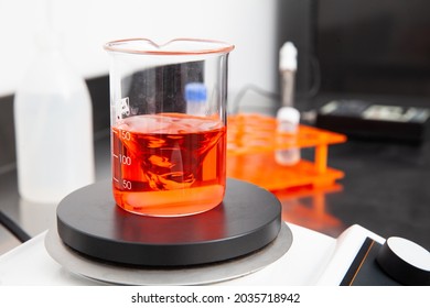 Magnetic stirrer mixing a liquid in a beaker at laboratory
