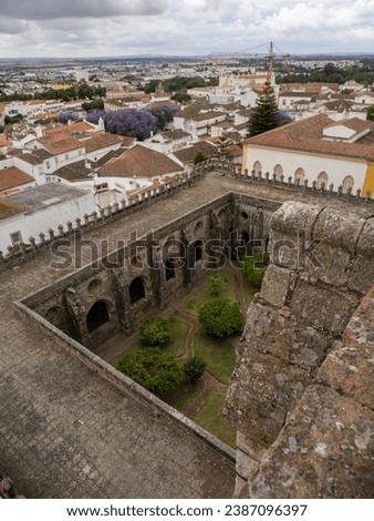 The magnificent Gothic cloister of Évora Cathedral, seen from an upper terrace, with the city in the background. Portugal. Сток-фото © 