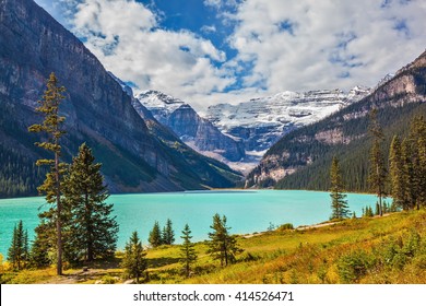 Magnificent Lake Louise Is Surrounded By Mountain Peaks And Glaciers. Rocky Mountains, Canada, Banff National Park. Great Sunny Day