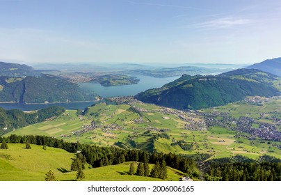 Magnificent panoramic aerial views of central Switzerland, mountains, villages and Lake Lucerne as you ascend the Cabrio cable car up Mount Stanserhorn in Switzerland. City of Stans.                  