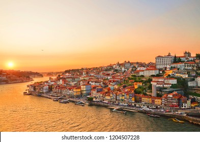 Magnificent sunset over the Porto city center and the Douro river, Portugal. Dom Luis I Bridge is a popular tourist spot as it offers such a beautiful view over the area. 