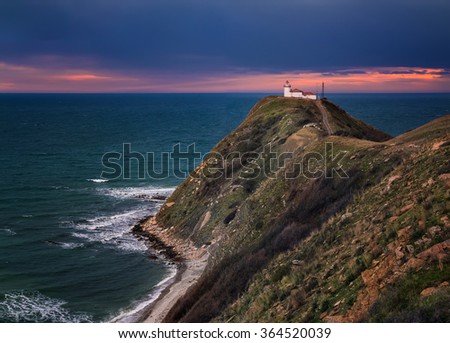 Magnificent sunset view of the lighthouse at Cape Emine, Black sea coast, Bulgaria. Cape Emine is the the easternmost point of the Balkan Mountains.