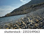 Magnificent view of Punta Molentis beach In Sardinia, taken during the summer: A completely uncontaminated and natural Mediterranean pebble beach.