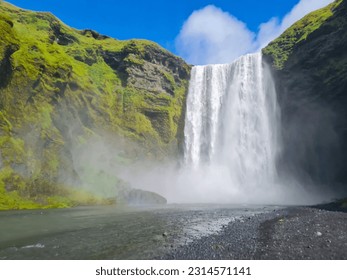 Skógafoss is a magnificent waterfall located in Iceland. It is known for its impressive height and the sheer power of its cascading waters. The waterfall is situated along the Skógá River, which flows - Powered by Shutterstock
