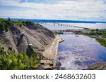 Magnificent wide angle panorama of the St.Lawrence river, the Pont de Ille bridge on a hot summer day taken from the top of the 83m high Montmorency Waterfalls near Quebec city,Canada